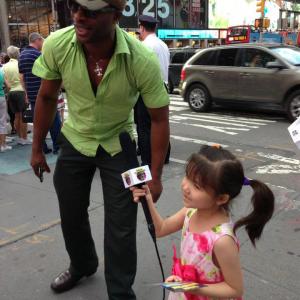 Executive Producer Richard Oliver Jr LIVE in time square being interviewed by up and coming child star Amanda Chen who is set to be featured in the 2nd episode of his hilarious comedy sketch entitled Mr  Mrs Chow