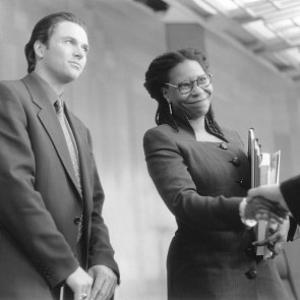 Still of Whoopi Goldberg and Tim Daly in The Associate 1996