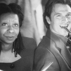 Still of Whoopi Goldberg and Tim Daly in The Associate 1996