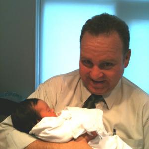 A star is born! Dean Dawson holding newborn baby Julia Rhodes