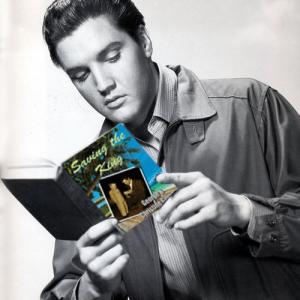 The King reading our book Saving the King