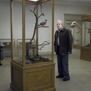 Still of Nils Westblom in En duva satt paring en gren och funderade paring tillvaron 2014