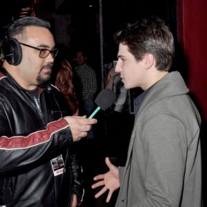 Still of Michael Grant doing an interview on the red carpet