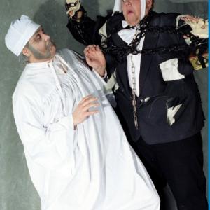 Hawke as Scrooge cringing from Jacob Marley in Malad Civic Theater production of A Christmas Carol