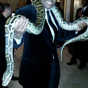 Adonis the Burmese Python and Mandell Frazier on set for Jackie Christies Bossard Cognac Commercial Shoot