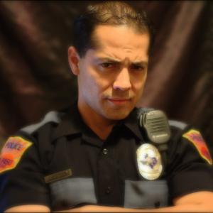 Edric Ray as a Police Officer
