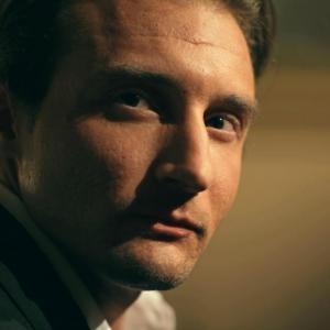 Al Vento portraying the role as businessmangangster in a Noir short film The Gadfly