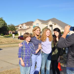 Kameron Badgers L Cassie Shea Watson Taylor Ernzen and Ashla Soter posting for Ghede Origins art director and actor Adam Dietrich for a family photo used as a prop in the film