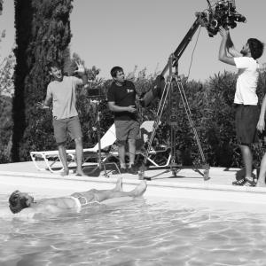 Director Philippe AudiDor rehearsing with actor Hugo Bolton as the crew sets up the shot