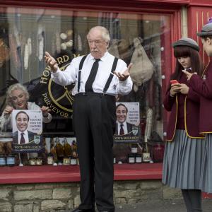 Still of Michael Gambon and Lauren Dowling in The Casual Vacancy 2015