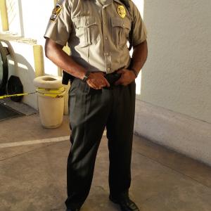Shante Tasby as security guard on set Graceland