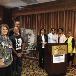 Oscar Micheaux The Czar of Black Hollywood writerdirector Bayer L Mack at podium with executive producer Frances Presley Rice to his immediate left