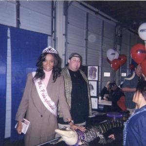 Ms Pennsylvania 2004 Maria Frisby petting a live alligator at a Harrisburg Senators public event