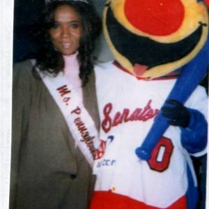 MsPennsylvania 2004 Maria Frisby with the Harrisburg Senators mascot during an appearance in 2004
