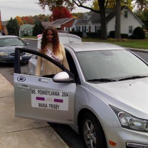 Ms.Pennsylvania 2004 Maria Frisby getting out of her escort's car after being in the 2015 Middletown Borough Homecoming Parade.