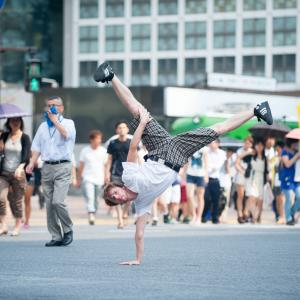 Jay Milnamow break dancing in the center of Shibuya Crossing Shibuya Tokyo Japan