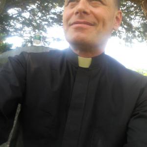 Rich Meiman as The Priest in 
