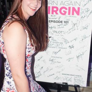 Lexi autographing the poster at the Born Again Virgin wrap party