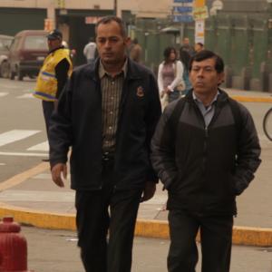 Oscar Ludeña (police deputy) and Oswaldo Salas (police detective Waldo Mamani) in a scene of the peruvian feature film 