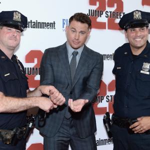 Actor Channing Tatum and NYPD offers attend the New York screening of 22 Jump Street at AMC Lincoln Square Theater on June 4 2014 in New York City
