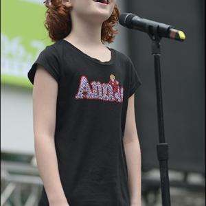 Taylor sings Tomorrow from Annie the Musical at Broadway in Bryant Park in NYC 2013