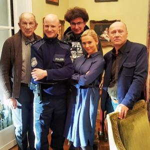 Anna Baranowska and scene partners Arkadiusz Bazak,Krzysztof Pieczynski, Sebastian Stegmann and director Jaroslaw Marszewski on set of 'Komisja Morderstw' TVP2, Poland