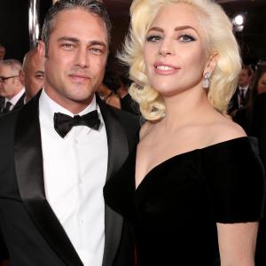 Taylor Kinney and Lady Gaga at event of 73rd Golden Globe Awards 2016