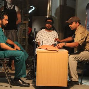 Ashok Chaudhary with the director Eshwar Gunturu at the set of a movie Back Up 