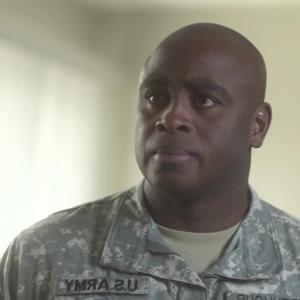 Still of Tommy Brown portraying the role of an Army Colonel in a US Army SHARP PSA in the military The video aired December 2013