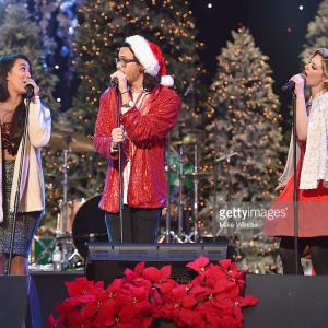 Alex  Sierra and Charity Daw with The Band Of Merrymakers perform at the 84th Annual Hollywood Christmas Parade