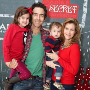 Actress Christie Lynn Smith attends 4th Annual Santa's Secret Workshop with daughter Abby Ryder Fortson, husband, Actor, John Fortson and son Joshua.