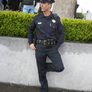 David L Schormann as an SFPD Officer on set of Murder In The First TNT Series Season 12014