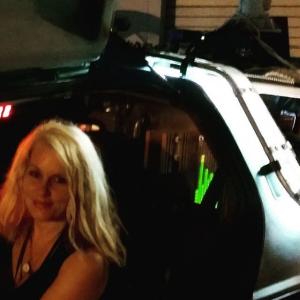 Assistant Director Amy Goodrich inside the original Delorean car of the 'Back to the Future' film celebrating its 30th Anniversary at the 'Burbank International Film Festival 2015',September 2015