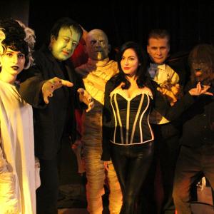 Talia Banuelos as The Bride, Perry Shields as Frankenstein's Monster, Alan August as The Mummy, Natalie Popovich as Ivonna Cadaver, Dean Scofield as Count Dracula, and Alexander Clague as The Wolf Man in MONSTER SCHOOL - A NEW SITCOM.