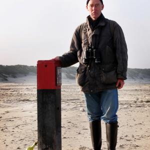 Portrait of Johan Wolf, a former teacher from The Netherlands who started combing messages in bottles during the 60's - 