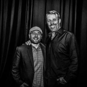 Steele with Tony Robbins behind stage during The Go Pro Recruiting Mastery Event