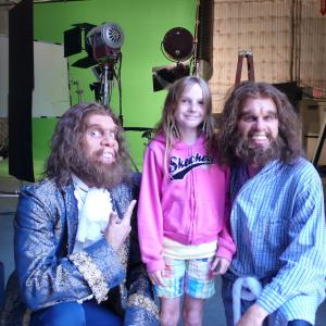 GEICO Caveman Online: Cavemen Jeff Phillips (L) , and John Lehr (R) meet with Kyra Elise Gardner prior to her going into prosthetic makeup to play the 