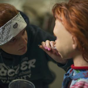 CURSE OF CHUCKY (2013) Kyra Gardner of Alterian, Inc. readies the animatronic Chucky for his closeup.