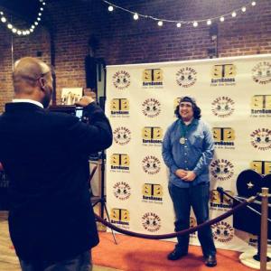 Raj Jawa getting his photo taken after P.A. wins Best Comedy Micro Short at 15th Bare Bones International Film & Music Festival in Muskogee, OK.