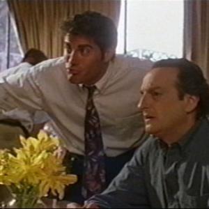 Paul Sampson inquires with David Paymer in the tongueandcheek comedy Enemies of Laughter