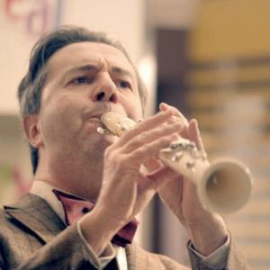 Still of Jean-Noel Martin with his white clarinet, in an advertising film (2012)