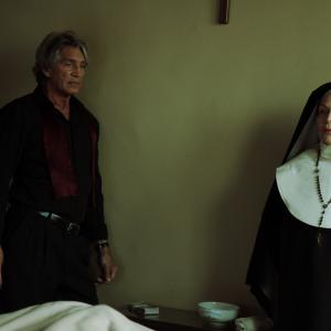 Iris Karina in a scene with actor Eric Roberts