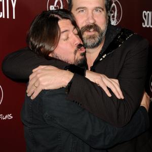 Dave Grohl and Krist Novoselic arrive at the premiere of Sound City at ArcLight Cinemas Cinerama Dome on January 31 2013 in Hollywood California