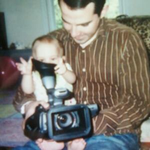 Jeremiah Bennett and his daughter Abigail Bennett with her first encounter with a video camera