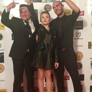 Chiara Aurelia receives Best Young Artist Diamond Award Cinerockom International Film Festival for Opal 2015 with DirectorProducer Aaron Alexander  Daniel Ruczko