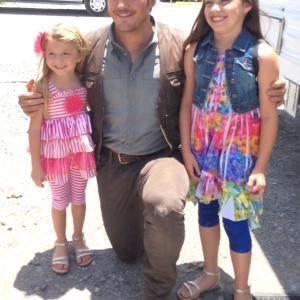 Chloe and Caitlyn Camille Perrin with Chris Pratt on the set of Jurassic World