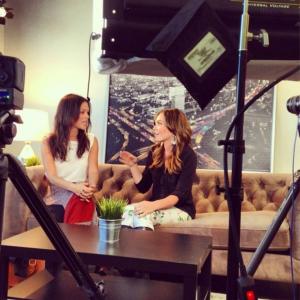 Lauren and Rachel Bilson chatting on-set before the cameras start rolling.