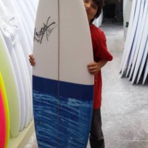 My Son Timothy Rustam Anton after learning on a softie getting his first TRustam Surfboard made in his own name the five fin barrel series swallow model  BTS  The Lab