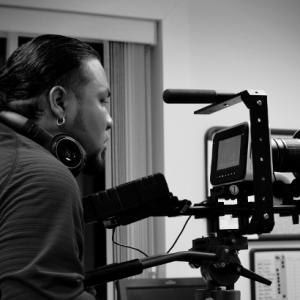 Director Pablo Macho Maysonet IV on the set of The Red Suit