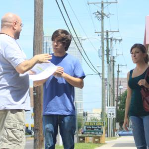 Director Donald E. Reynolds talking with Justifiable Circumstances' leads Michael Rodriguez and Natalie Stavola.